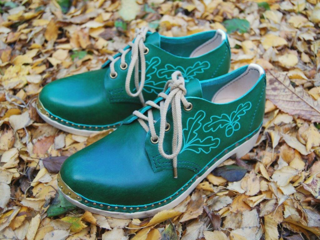 Green Gibson clogs with oak leaf ‘crimp’